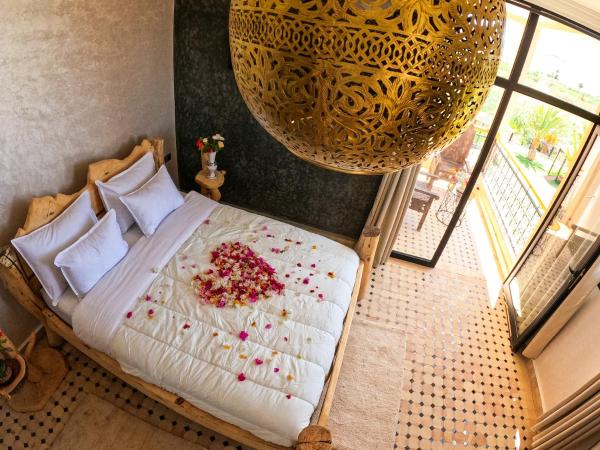 kasbah yu palace : photo 4 de la chambre chambre familiale - vue sur jardin