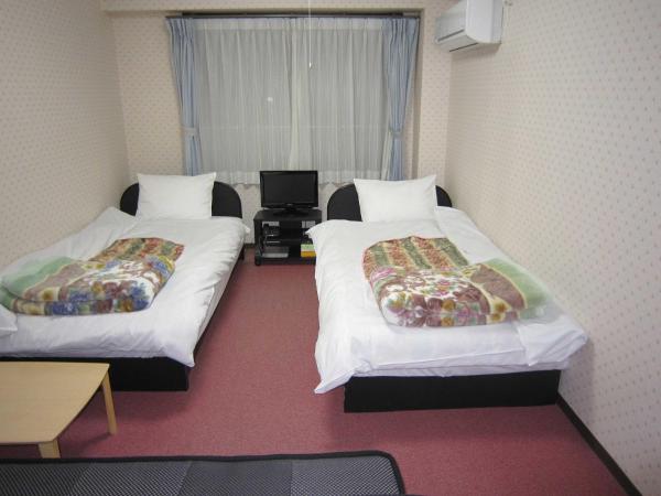 Pension Kitashirakawa : photo 2 de la chambre chambre triple avec salle de bains privative