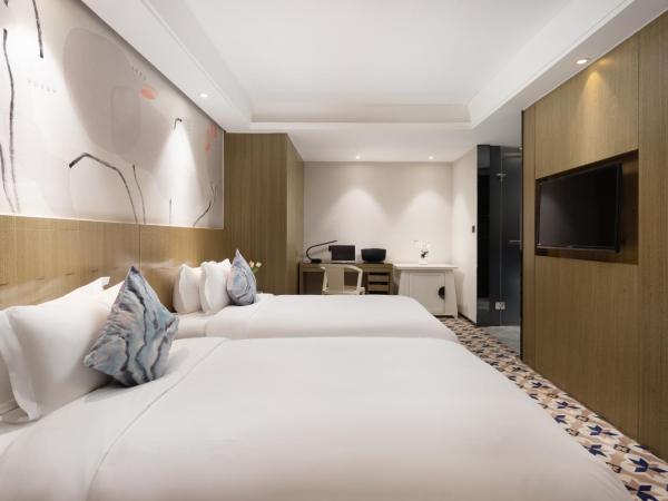 Paco Hotel Gangding Metro Guangzhou-Free Shuttle Bus during Canton Fair : photo 3 de la chambre chambre lits jumeaux supérieure sans fenêtre
