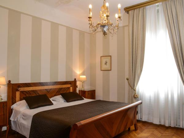 Hotel Vittoria : photo 2 de la chambre chambre quadruple