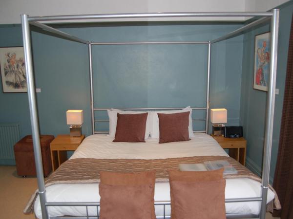Brightonwave : photo 2 de la chambre chambre avec lit à baldaquin et balcon - 2 personnes