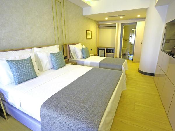 Leaf Port Hotel : photo 1 de la chambre chambre triple - vue sur ville