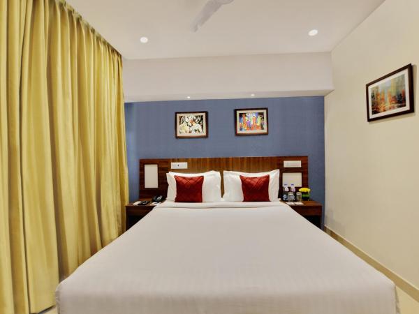 Manpho Bell Hotel & Convention Center : photo 3 de la chambre chambre deluxe double ou lits jumeaux