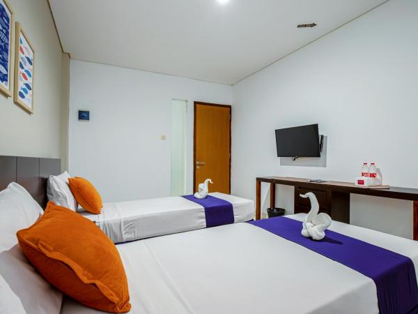Sans Hotel Prime Cailendra Yogyakarta by RedDoorz : photo 3 de la chambre chambre lits jumeaux deluxe