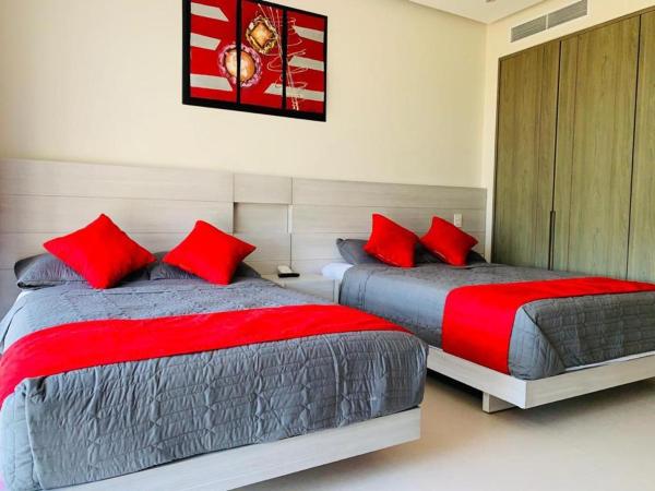 DEPARTAMENTO DE LUJO EN ACAPULCO DIAMANTE : photo 2 de la chambre chambre lits jumeaux