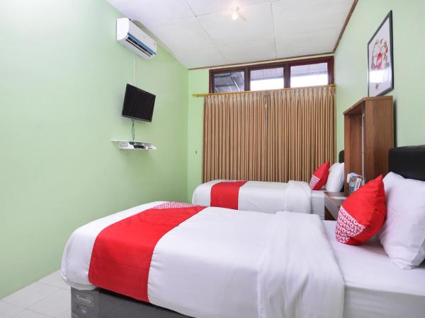 Super OYO 1046 Omah Pathok : photo 8 de la chambre chambre lits jumeaux deluxe