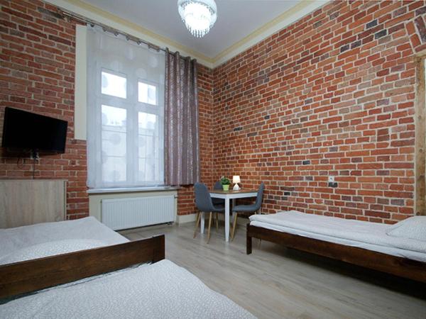 Vanilla Hostel Wrocław : photo 4 de la chambre chambre triple avec salle de bains privative