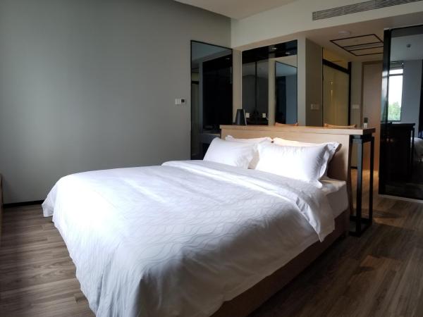 Unijoy Cityinn OCT Loft Shenzhen有集城市客栈创意园店 : photo 3 de la chambre chambre lit queen-size deluxe