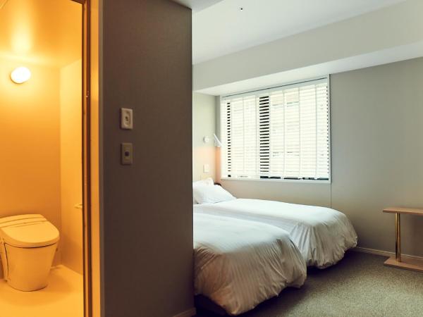 Hotel It Osaka Shinmachi : photo 1 de la chambre chambre lits jumeaux pour personnes à mobilité réduite