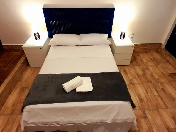 LÍAH Hostel & Suites : photo 7 de la chambre chambre triple Économique