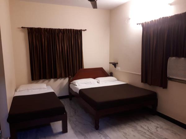 Rmc travellers inn : photo 1 de la chambre chambre triple basique