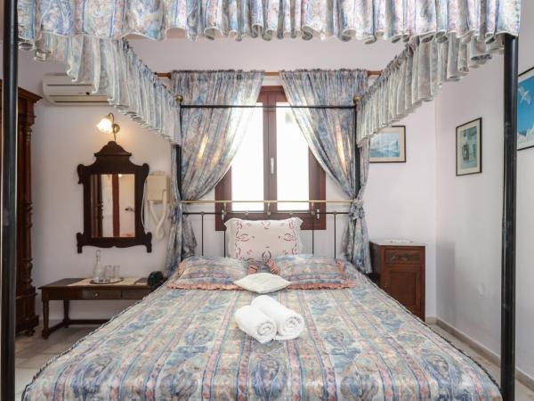 Chateau Zevgoli : photo 2 de la chambre suite junior - vue sur jardin