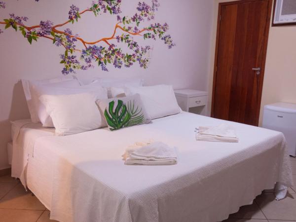 Pousada Praia e Conforto : photo 2 de la chambre chambre triple deluxe