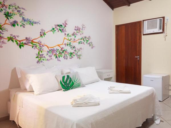 Pousada Praia e Conforto : photo 1 de la chambre chambre triple deluxe