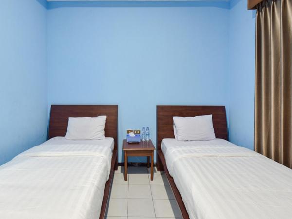 Sekar Ayu Hotel Malioboro Mitra RedDoorz : photo 4 de la chambre chambre lits jumeaux supérieure