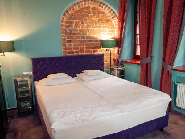 Apartamenty Siedem Komnat Siedmiu Mistrzów : photo 6 de la chambre chambre double ou lits jumeaux