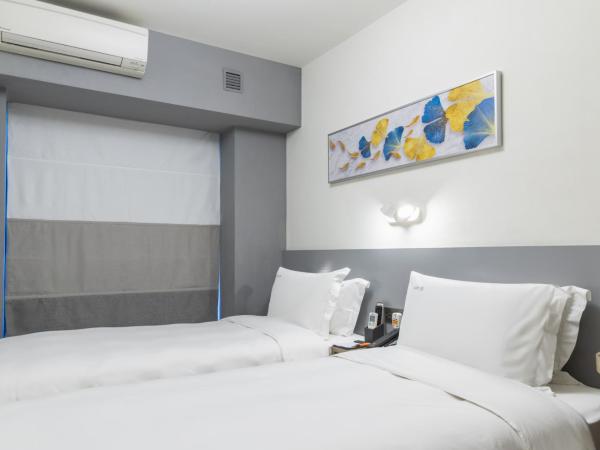 City Inn Macau : photo 4 de la chambre chambre deluxe double ou lits jumeaux