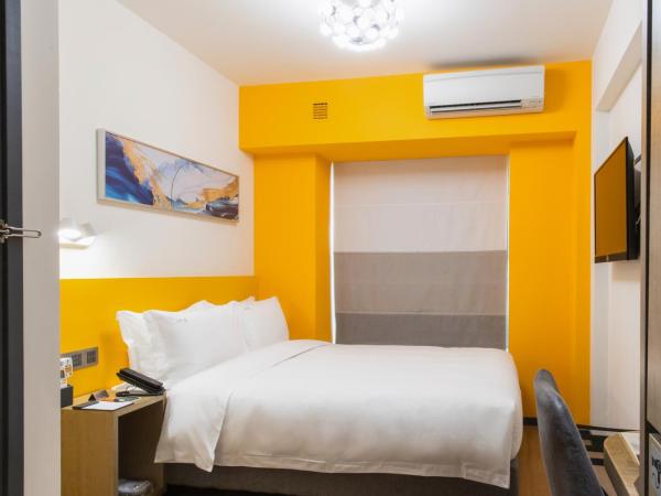City Inn Macau : photo 4 de la chambre chambre lit queen-size deluxe