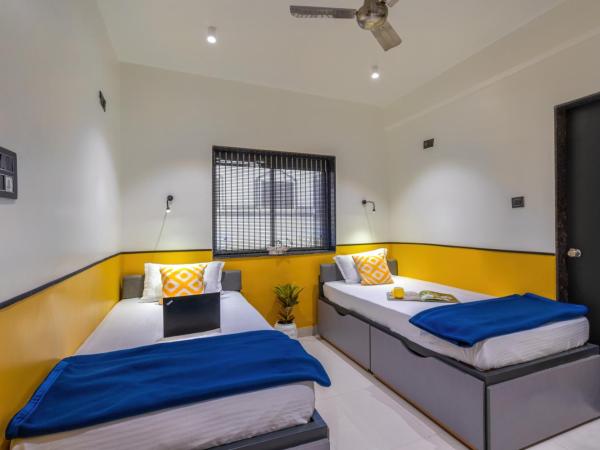 Coliwo Un - Viman Nagar : photo 1 de la chambre chambre deluxe double ou lits jumeaux