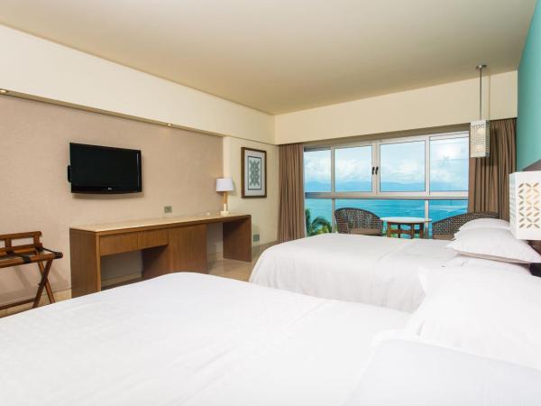 Sheraton Buganvilias Resort & Convention Center : photo 1 de la chambre grande chambre deluxe avec 2 lits doubles - vue sur baie