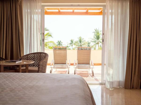 Sheraton Buganvilias Resort & Convention Center : photo 4 de la chambre chambre avec 2 lits doubles et balcon - vue sur jardin et terrasse bien exposée