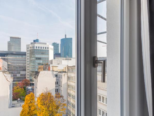 numa I Blau Apartments : photo 4 de la chambre large studio with kitchenette
