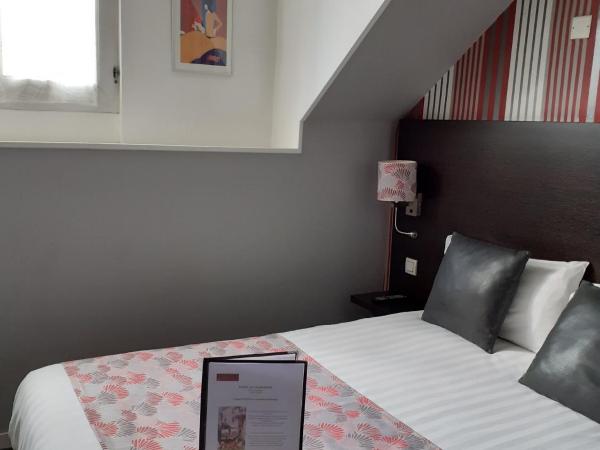 Hotel Le Charleston : photo 1 de la chambre chambre triple