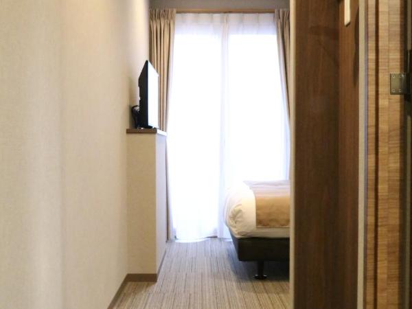 C＆Jホテル : photo 1 de la chambre chambre lits jumeaux