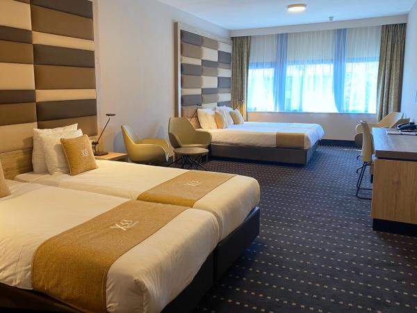 XO Hotels Blue Square : photo 1 de la chambre chambre quadruple