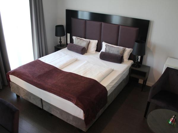 Arena Villa am Wasserpark : photo 1 de la chambre chambre double supérieure