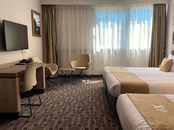 XO Hotels Blue Square : photo 3 de la chambre chambre triple