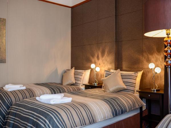 Tanes Hotel : photo 2 de la chambre chambre lits jumeaux standard avec salle de bains commune