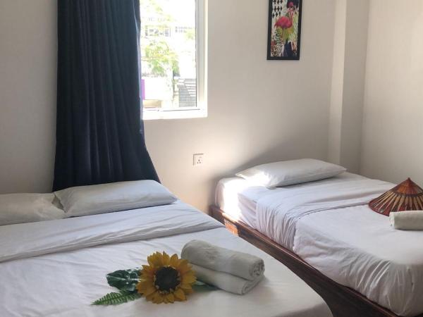 Kapit Hotel : photo 1 de la chambre chambre triple