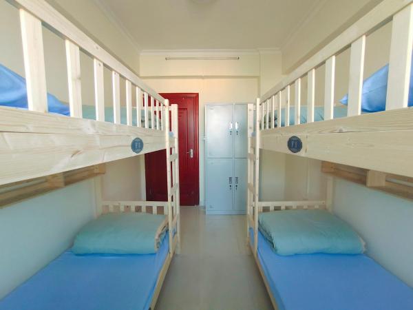 都市小憩青旅 : photo 4 de la chambre chambre quadruple Économique