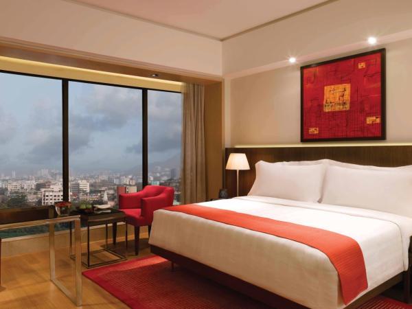 Trident Bandra Kurla : photo 7 de la chambre suite deluxe avec transferts aéroport aller-retour et accès au salon