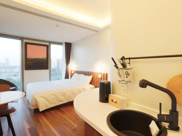 7Shang@金尚·丽 : photo 1 de la chambre chambre lit queen-size deluxe