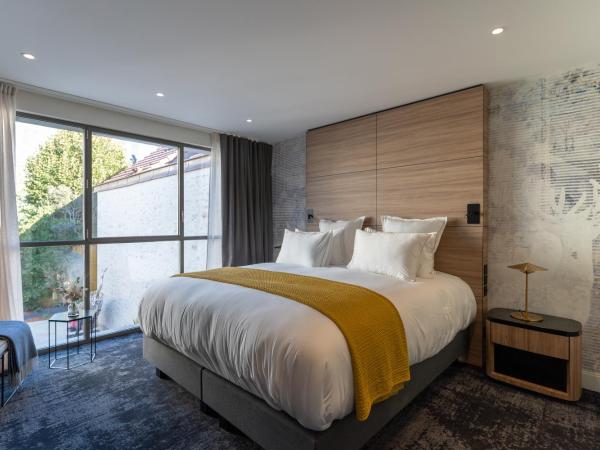 Les Trésorières : photo 4 de la chambre chambre double deluxe (annexe « le cube »)