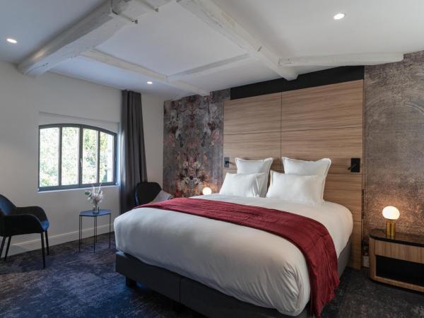 Les Trésorières : photo 2 de la chambre chambre deluxe - vue sur jardin (annexe « l'orangerie »)