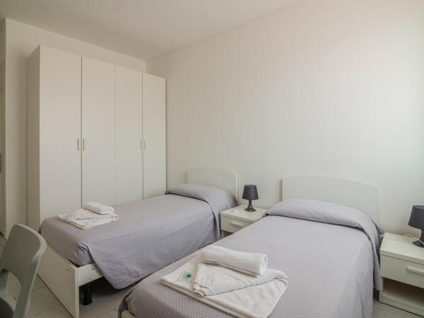 Casa Lucia Valentini Terrani : photo 2 de la chambre chambre lits jumeaux