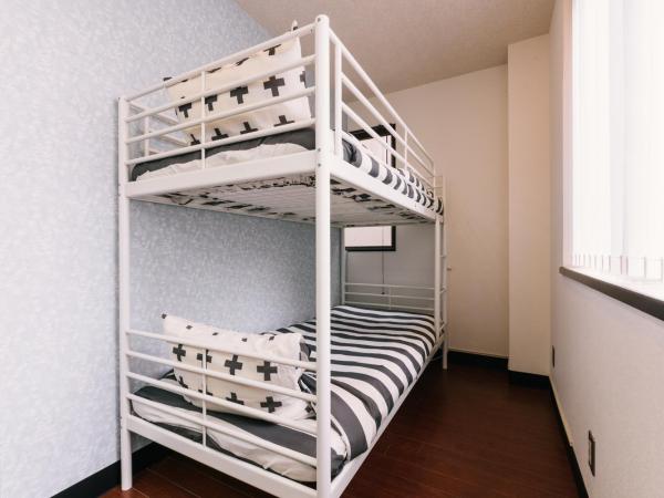 Guest House Yasuragi Hakataekimae : photo 2 de la chambre chambre lits jumeaux Économique