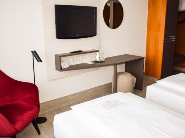 Ramada by Wyndham Dresden : photo 4 de la chambre chambre lits jumeaux standard