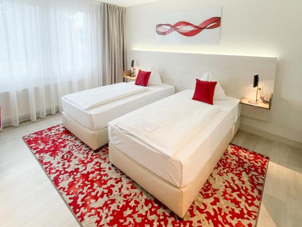 Ramada by Wyndham Dresden : photo 2 de la chambre chambre lits jumeaux standard