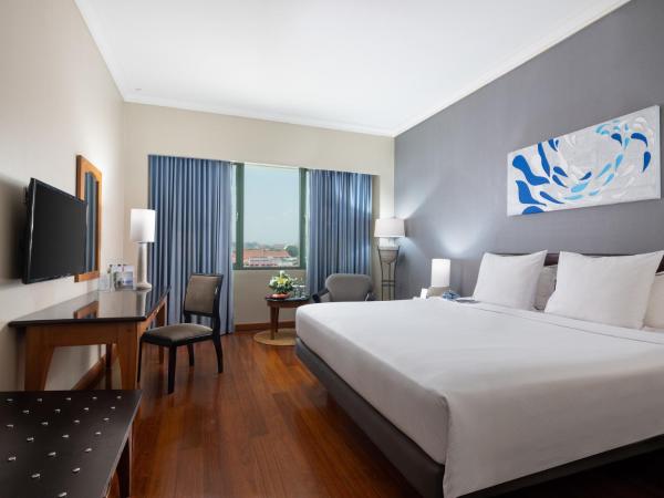 Kimaya Sudirman Yogyakarta by Harris : photo 6 de la chambre chambre deluxe double ou lits jumeaux