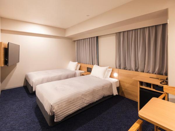 Sotetsu Fresa Inn Nagoya-Shinkansenguchi : photo 1 de la chambre hébergement lits jumeaux universal - non-fumeurs