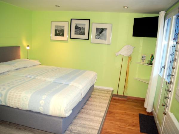 Hotel Lauberhorn - Home for Outdoor Activities : photo 5 de la chambre chambre double lifestyle avec balcon
