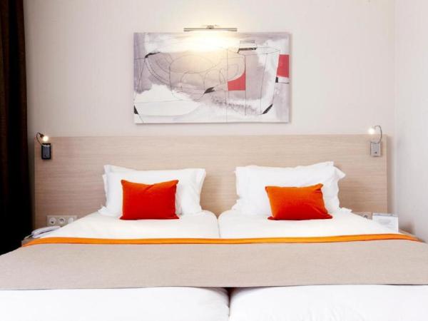 Kyriad Prestige Vannes Centre-Palais des Arts : photo 1 de la chambre chambre lits jumeaux