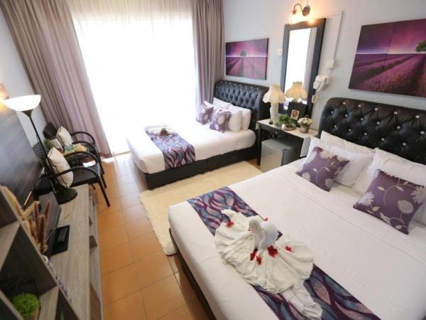 Ghazrins Garuda JB : photo 1 de la chambre chambre familiale supérieure