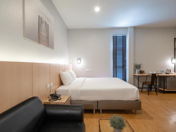 The Arbern Hotel x Bistro - SHA Extra Plus : photo 1 de la chambre suite deluxe avec lit king-size