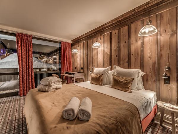 HOTEL LE VAL D'ISERE : photo 3 de la chambre chambre quadruple standard avec lits superposs