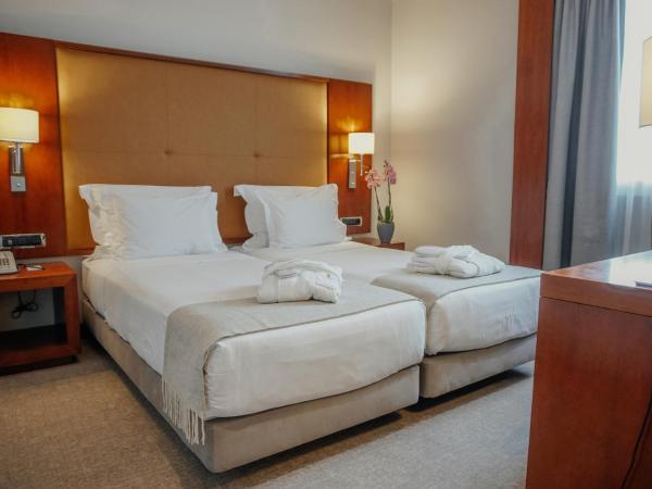 Hotel Dom Carlos Liberty : photo 1 de la chambre chambre double ou lits jumeaux